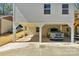 Under-house carport area that is spacious and offers ample covered parking at 215 Wyanoke Ave, Charlotte, NC 28205
