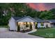 Stylish home with a front porch, landscaping and a curved walkway leading to the entrance at 215 Wyanoke Ave, Charlotte, NC 28205