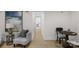 Well-lit hallway leading to a cozy seating area, showcasing the home's comfortable and inviting layout at 215 Wyanoke Ave, Charlotte, NC 28205