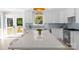 Gourmet kitchen featuring a large island, stainless steel appliances, and designer finishes throughout at 215 Wyanoke Ave, Charlotte, NC 28205