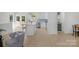 Bright, modern kitchen with stainless steel appliances, center island, and easy access to outdoor living area at 215 Wyanoke Ave, Charlotte, NC 28205