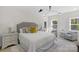 Comfortable bedroom features a king bed, neutral tones, and stylish decor at 215 Wyanoke Ave, Charlotte, NC 28205