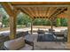Covered patio with seating area, ideal for enjoying the outdoors in any weather at 215 Wyanoke Ave, Charlotte, NC 28205