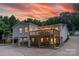 Spacious backyard featuring a raised deck, patio, and ample seating for entertaining at 215 Wyanoke Ave, Charlotte, NC 28205