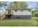 Backyard view showcasing the exterior of the home and deck area at 2403 Earley Cir, Kannapolis, NC 28083