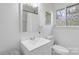 Clean bathroom with sleek vanity, toilet, and natural light from the window at 2403 Earley Cir, Kannapolis, NC 28083