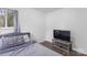 Serene bedroom with soft lighting, a modern TV stand, and a neatly arranged bed at 2403 Earley Cir, Kannapolis, NC 28083