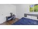 Cozy bedroom featuring a comfortable bed, hardwood floors, and a bright window at 2403 Earley Cir, Kannapolis, NC 28083