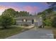 Charming single-story home featuring updated siding and professional landscaping at 2403 Earley Cir, Kannapolis, NC 28083