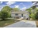 Charming single-story home with a lush yard, a concrete driveway and unique architectural details at 2403 Earley Cir, Kannapolis, NC 28083