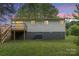 View of the backyard of the home with a small deck and stairs leading to the ground level at 2403 Earley Cir, Kannapolis, NC 28083
