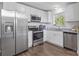Modern kitchen features stainless steel appliances, granite countertops, and bright white cabinetry at 2403 Earley Cir, Kannapolis, NC 28083