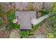 Aerial view of home with a stone firepit, patio, long driveway and lush landscaping at 2587 Penngate Dr, Sherrills Ford, NC 28673