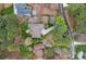 Overhead view of a secluded home surrounded by mature trees, a long driveway, and lush landscaping at 2587 Penngate Dr, Sherrills Ford, NC 28673