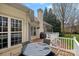 Spacious back deck with outdoor dining table and serene backyard views from the outdoor living space at 2587 Penngate Dr, Sherrills Ford, NC 28673
