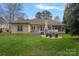 Large backyard with a patio and outdoor seating area, perfect for outdoor relaxation and entertaining at 2587 Penngate Dr, Sherrills Ford, NC 28673