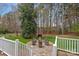 Landscaped backyard with a cozy fire pit area and outdoor seating, great for gatherings at 2587 Penngate Dr, Sherrills Ford, NC 28673