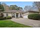 Single Gathering home with large arched windows, columns at the front door and well manicured shrubs at 2587 Penngate Dr, Sherrills Ford, NC 28673