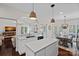 Modern kitchen with an island, quartz countertops, and an open floorplan adjacent to the dining area at 2587 Penngate Dr, Sherrills Ford, NC 28673