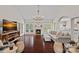 Open concept living room with vaulted ceilings, a fireplace, and hardwood floors for a bright look at 2587 Penngate Dr, Sherrills Ford, NC 28673