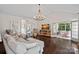 Spacious living room with hardwood floors, high ceilings, a statement chandelier and a fireplace at 2587 Penngate Dr, Sherrills Ford, NC 28673