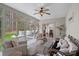 Relaxing sunroom with cushioned seating and large windows overlooking the backyard and deck at 2587 Penngate Dr, Sherrills Ford, NC 28673