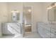 Elegantly designed bathroom with double vanities, sleek fixtures, and a doorway offering a glimpse into the adjacent room at 2924 Sharon View Rd # C, Charlotte, NC 28210