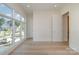 Bedroom with wood floors, neutral walls, and a wall of windows with exterior view at 2924 Sharon View Rd # C, Charlotte, NC 28210