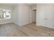 Bedroom features wood floors, neutral walls, and double door closet at 2924 Sharon View Rd # C, Charlotte, NC 28210