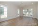 Bright bedroom with large windows, hardwood floors, and ample natural light at 2924 Sharon View Rd # C, Charlotte, NC 28210