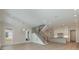 Bright living space with hardwood floors, a staircase, and a view into the modern kitchen at 2924 Sharon View Rd # C, Charlotte, NC 28210