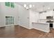 Open-concept living area with large windows, flowing into the modern kitchen space at 3008 Finchborough Ct # 227, Charlotte, NC 28269