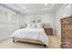 Serene bedroom with tray ceilings, a neutral color palette, and ample natural light at 3111 Everly Enclave Way, Charlotte, NC 28210