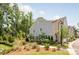Charming two-story townhome featuring brick and siding, an attached garage, and a welcoming walkway at 3111 Everly Enclave Way, Charlotte, NC 28210