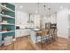 Well-appointed kitchen featuring a central island, pendant lighting, and modern appliances at 3111 Everly Enclave Way, Charlotte, NC 28210