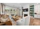 Cozy living room with a fireplace, built-in shelves, and sliding doors to the backyard at 3111 Everly Enclave Way, Charlotte, NC 28210