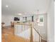 Staircase leading to living room with hardwood floors and recessed lighting at 3111 Everly Enclave Way, Charlotte, NC 28210