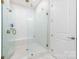 Shower with a glass door, marble tile walls, and a built-in bench at 3111 Everly Enclave Way, Charlotte, NC 28210