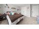 Cozy bedroom with neutral walls, comfortable bed, and decorative shelves offers a relaxing retreat at 4006 Stockbrook Dr, Charlotte, NC 28215