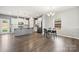 Open kitchen with a center island, stainless steel appliances and connected dining area at 4006 Stockbrook Dr, Charlotte, NC 28215