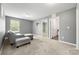 Spacious living room with ample natural light and plush carpeting creates a comfortable gathering space at 4006 Stockbrook Dr, Charlotte, NC 28215