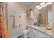 Cozy bathroom features granite counters, updated fixtures and decorative elements for a relaxing, spa-like ambiance at 405 E 3Rd St, Kannapolis, NC 28083