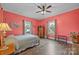 Cozy bedroom featuring hardwood floors, windows for ample light and a ceiling fan at 405 E 3Rd St, Kannapolis, NC 28083