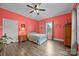 Bright bedroom with hardwood floors, neutral decor, and a ceiling fan at 405 E 3Rd St, Kannapolis, NC 28083