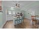 Well-lit kitchen with white cabinets, granite countertops, and island seating at 405 E 3Rd St, Kannapolis, NC 28083