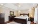 Bedroom with a dark wood bedroom set with bed, dresser and bedside table at 420 Woodlark Ct, Indian Trail, NC 28079