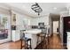 Bright kitchen featuring white cabinets, center island, and stainless steel appliances at 420 Woodlark Ct, Indian Trail, NC 28079
