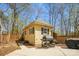 Backyard with a charming outbuilding featuring a grill, ideal for outdoor gatherings at 420 Woodlark Ct, Indian Trail, NC 28079
