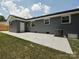 Well-maintained backyard with brick home, patio, and fresh landscaping at 445 Short Hills Dr, Charlotte, NC 28217