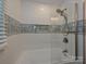 Modern bathroom with decorative tile, new fixtures and glass shower surround at 445 Short Hills Dr, Charlotte, NC 28217